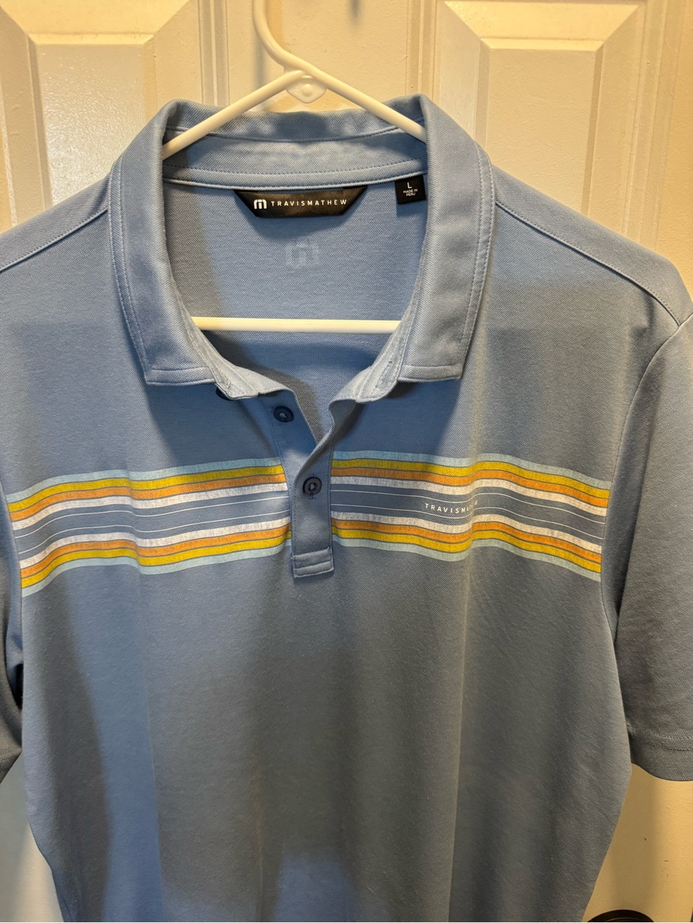 Travis Mathew Light Blue Polo with Yellow & White Stripe Detail